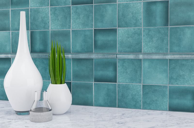 Soft, matte white tiles provide a peaceful and understated backdrop, enhancing the serene ambiance of the room.