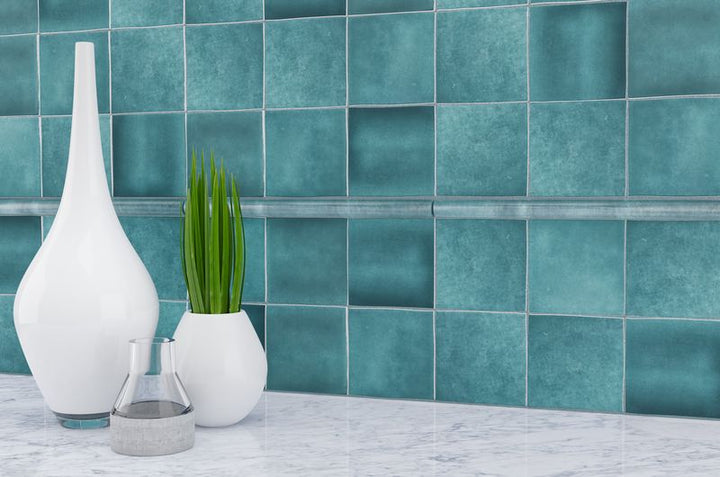 Soft, matte white tiles provide a peaceful and understated backdrop, enhancing the serene ambiance of the room.