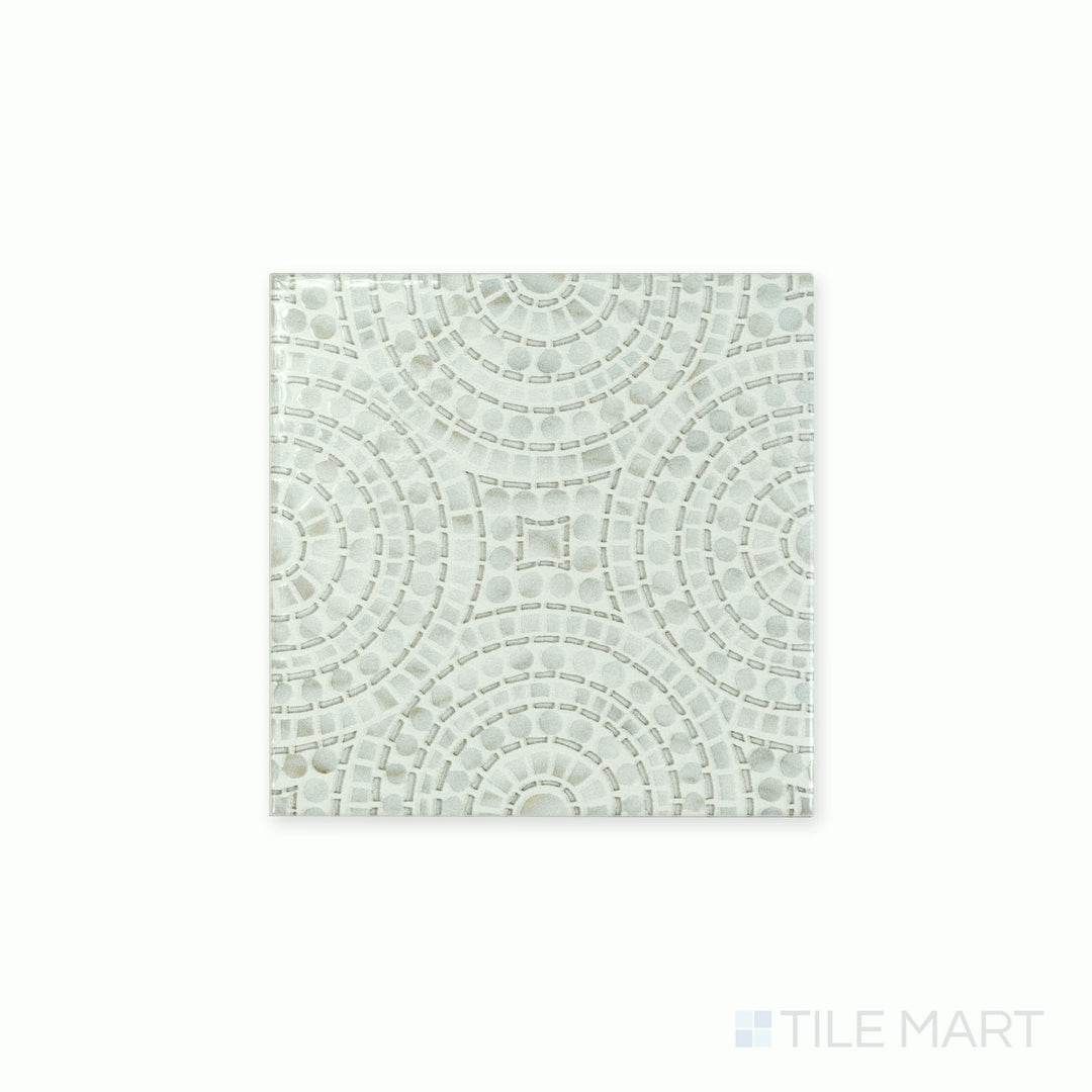 Angled shot showcasing the beige and tan ceramic tile from the Boutique Sleek series, highlighting its smooth surface and refined texture.