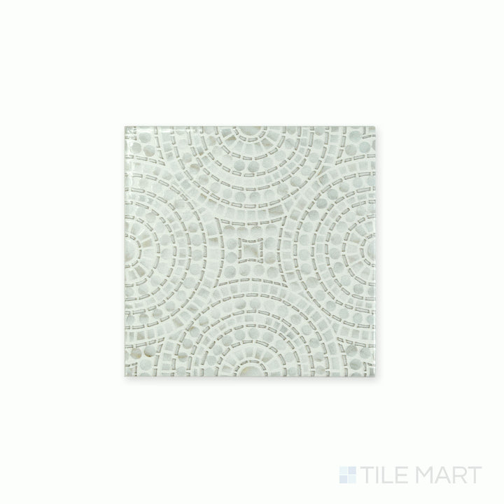 Angled shot showcasing the beige and tan ceramic tile from the Boutique Sleek series, highlighting its smooth surface and refined texture.