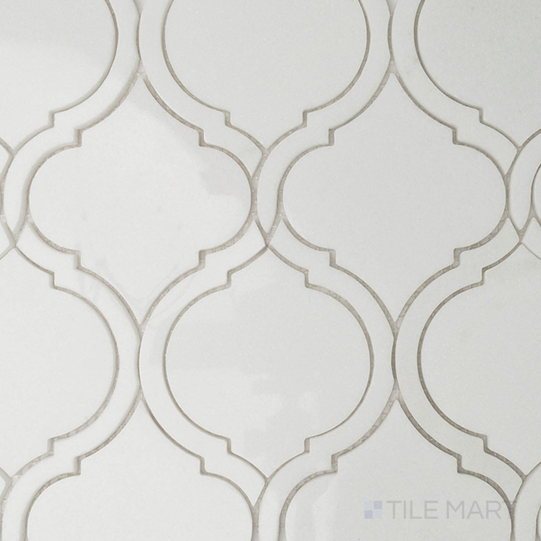 A beige tile with intricate tonal patterns, accented by a matte finish that adds understated elegance to any space.