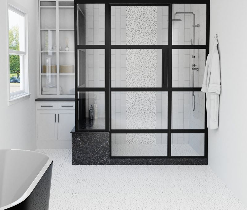The dark gray and black tile from the Boutique Sleek series adds sophistication and depth to this contemporary space.