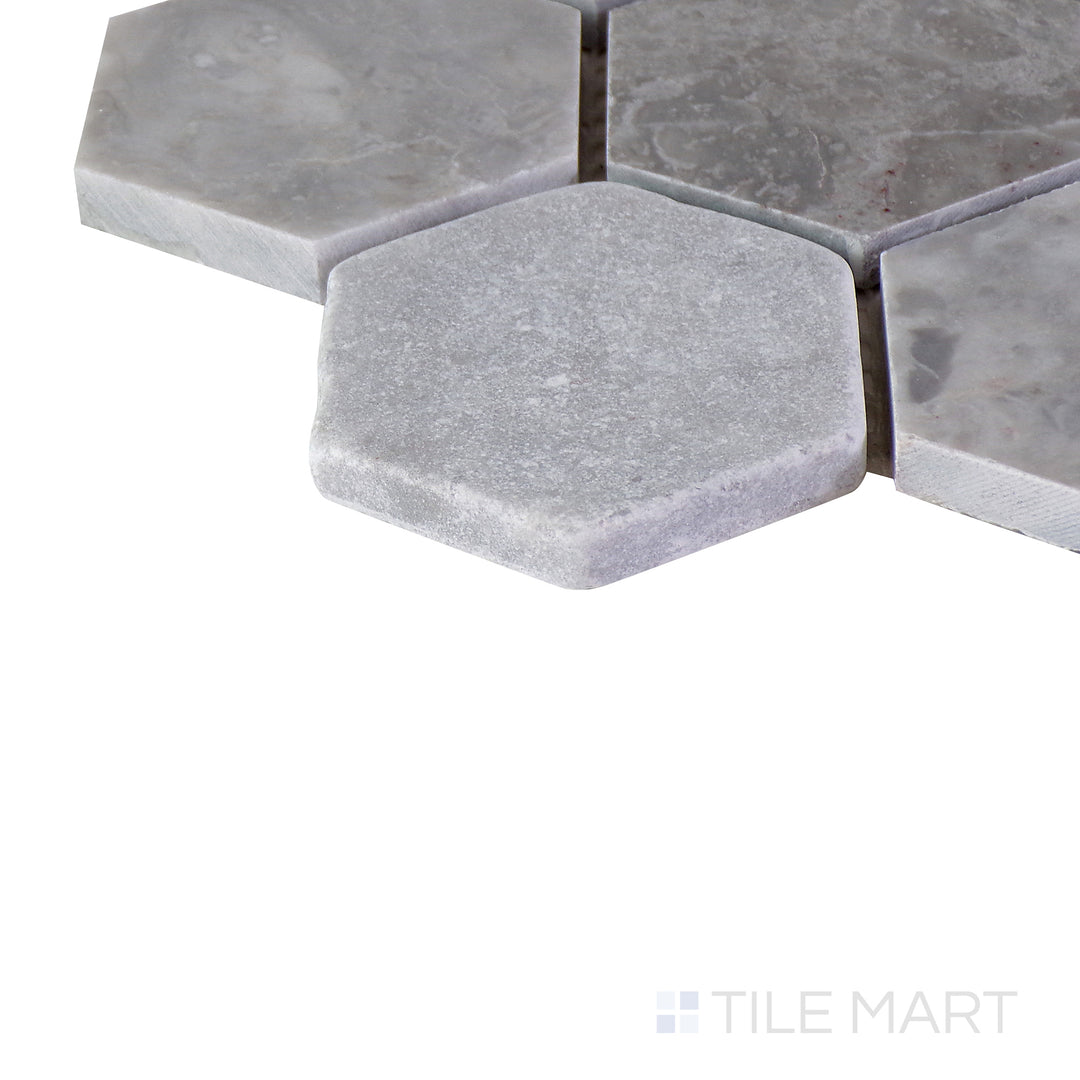 Close-up corner shot of the glossy white tile, showing its ceramic build and sleek edges.