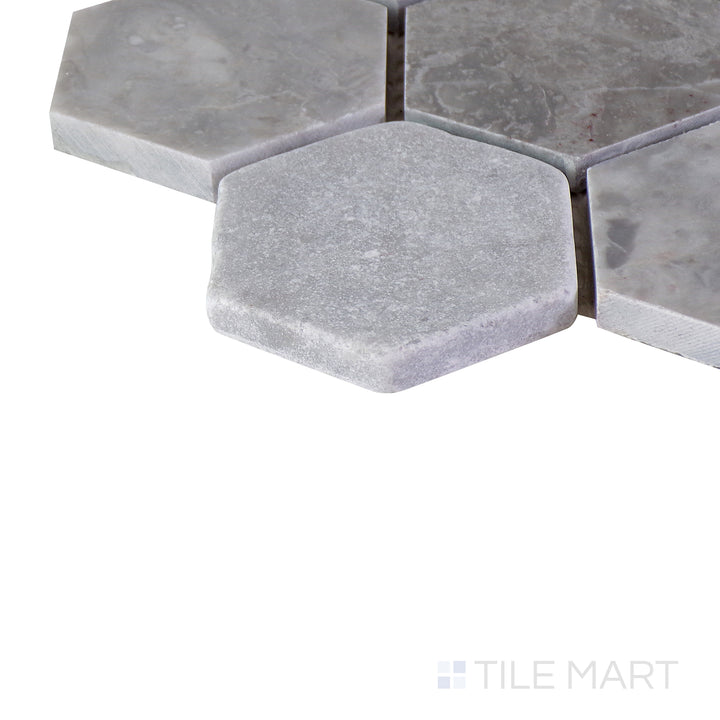 Close-up corner shot of the glossy white tile, showing its ceramic build and sleek edges.