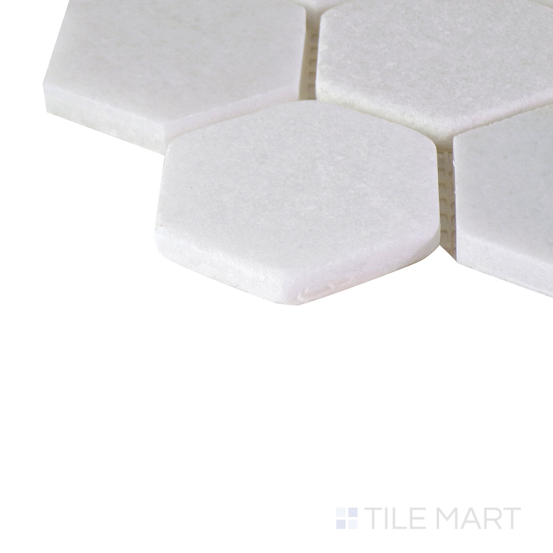 Corner shot of the tan and beige tile, emphasizing its thickness and high-quality ceramic material.