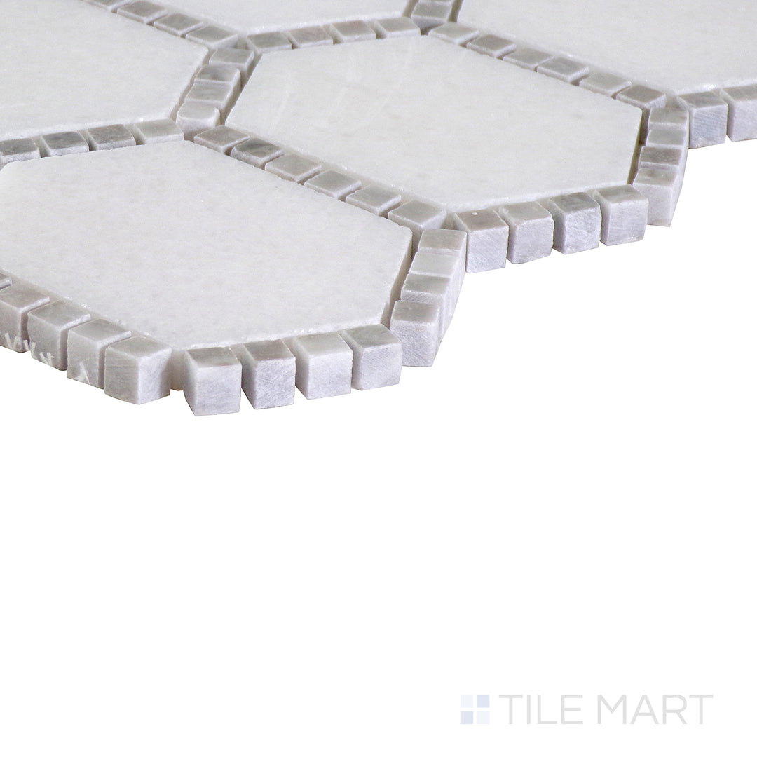 The indigo blue tile from the Boutique Sleek series, captured from an angle to emphasize its striking color and matte finish.