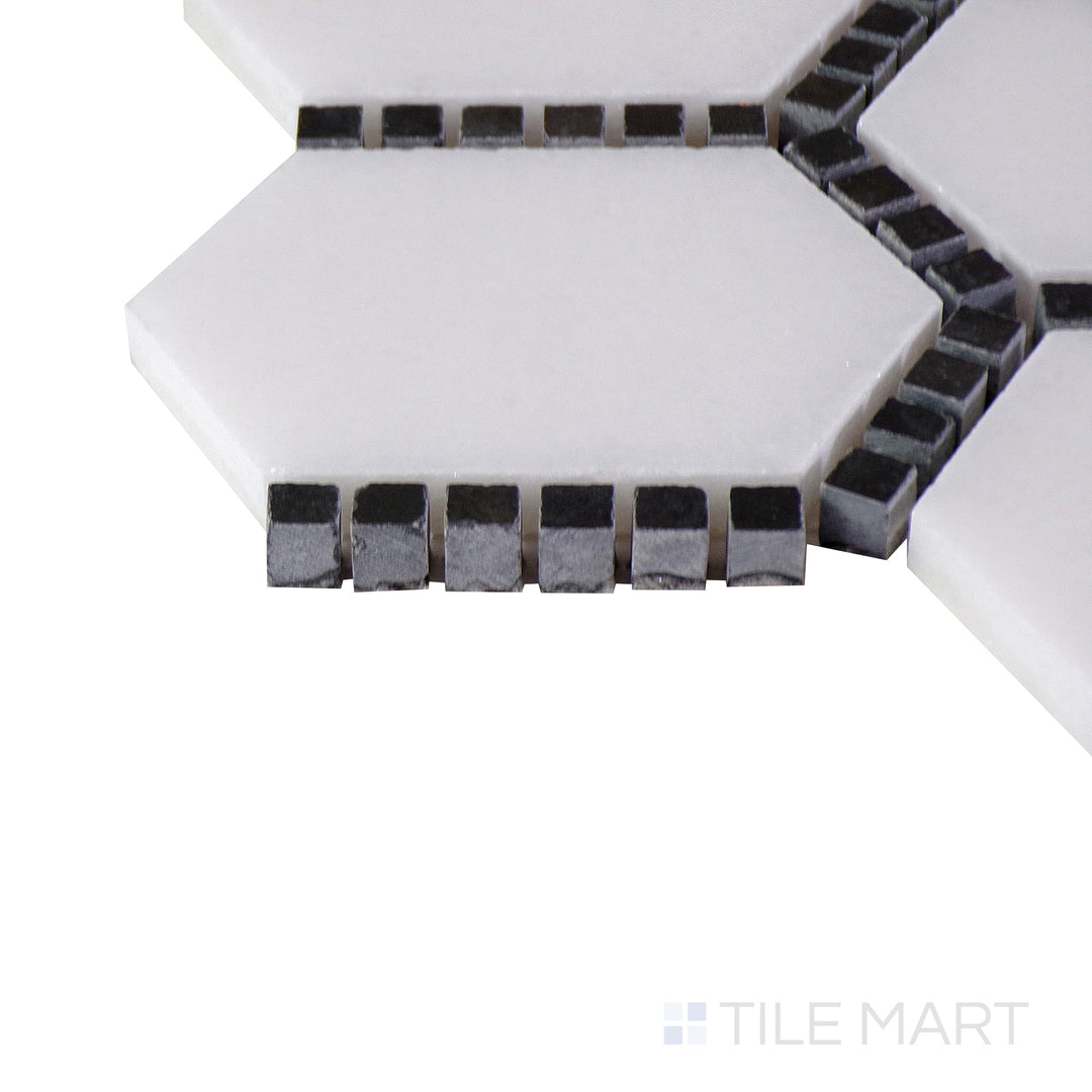 A close-up of the matte white tile's corner, showing its refined edges and robust material thickness.
