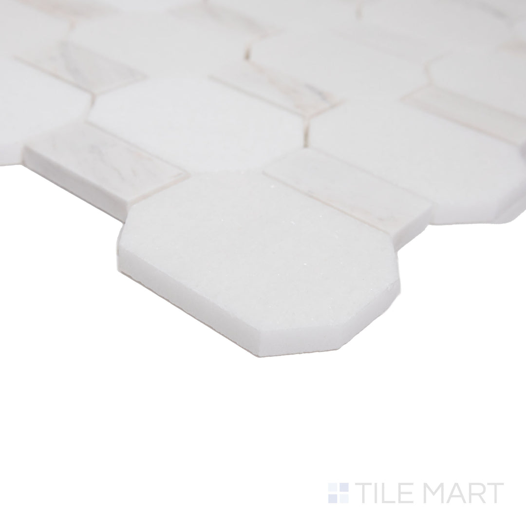 Angled shot showcasing the beige and tan ceramic tile from the Boutique Sleek series, highlighting its smooth surface and refined texture.