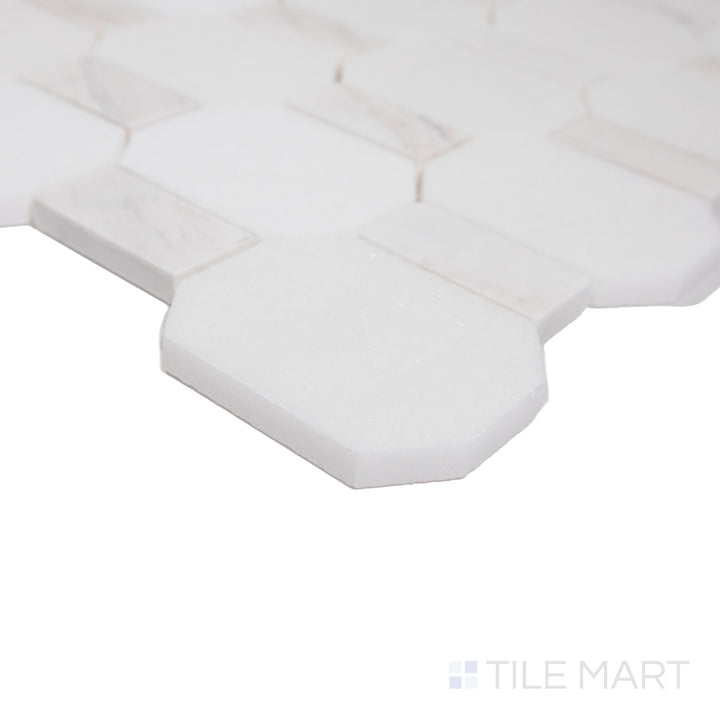 Angled shot showcasing the beige and tan ceramic tile from the Boutique Sleek series, highlighting its smooth surface and refined texture.