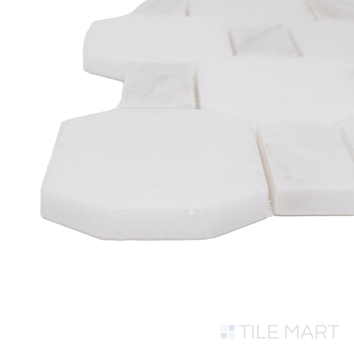 Corner shot of the beige and tan ceramic tile from the Boutique Sleek series, highlighting its material composition and slim profile.