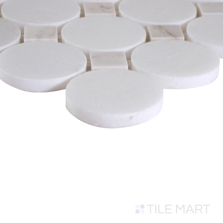 Angled shot showcasing the beige and tan ceramic tile from the Boutique Sleek series, highlighting its smooth surface and refined texture.