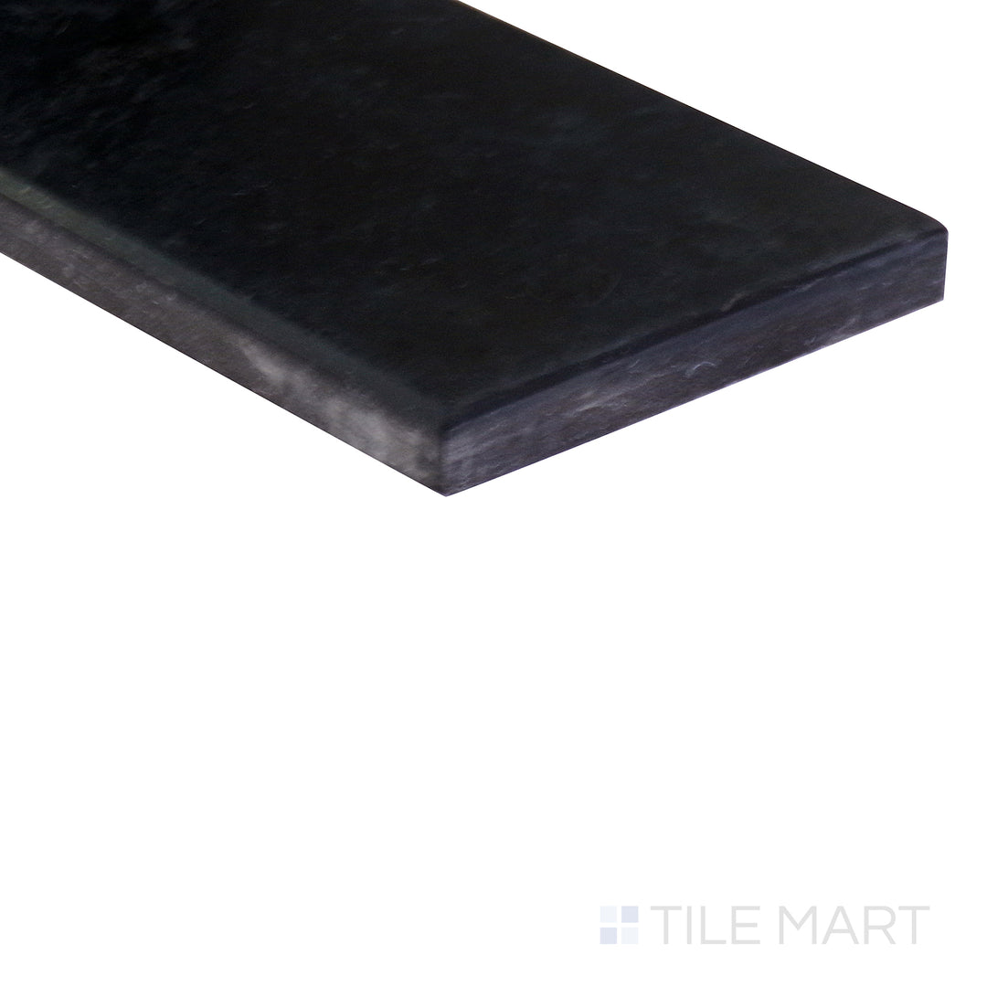 Angled shot showcasing the beige and tan ceramic tile from the Boutique Sleek series, highlighting its smooth surface and refined texture.