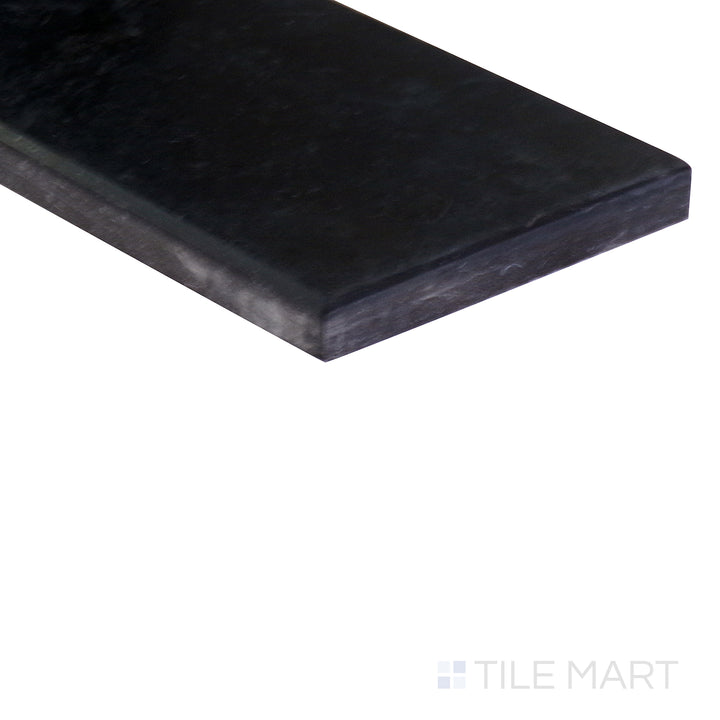 Angled shot showcasing the beige and tan ceramic tile from the Boutique Sleek series, highlighting its smooth surface and refined texture.