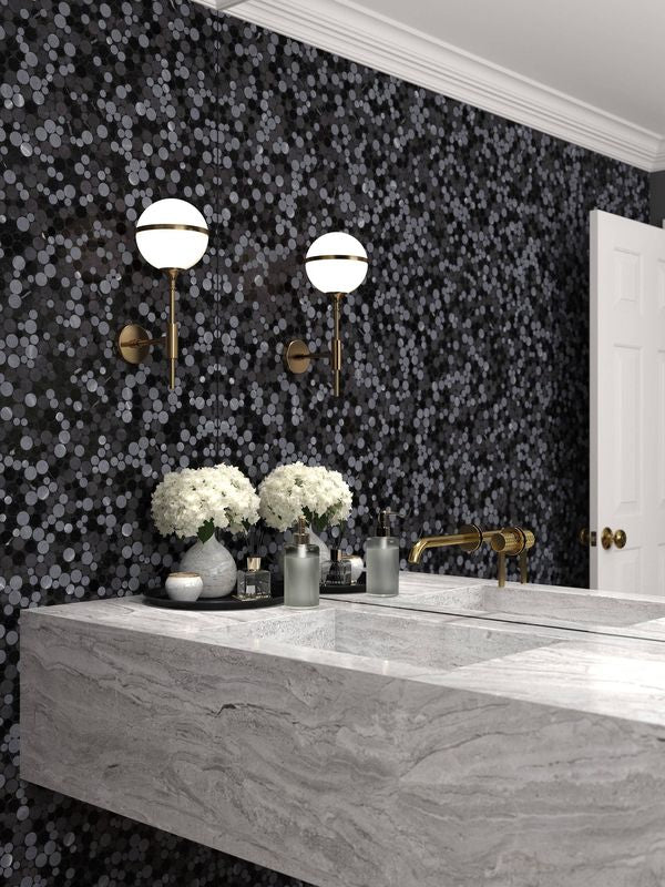 The dark gray and black tile from the Boutique Sleek series adds sophistication and depth to this contemporary space.