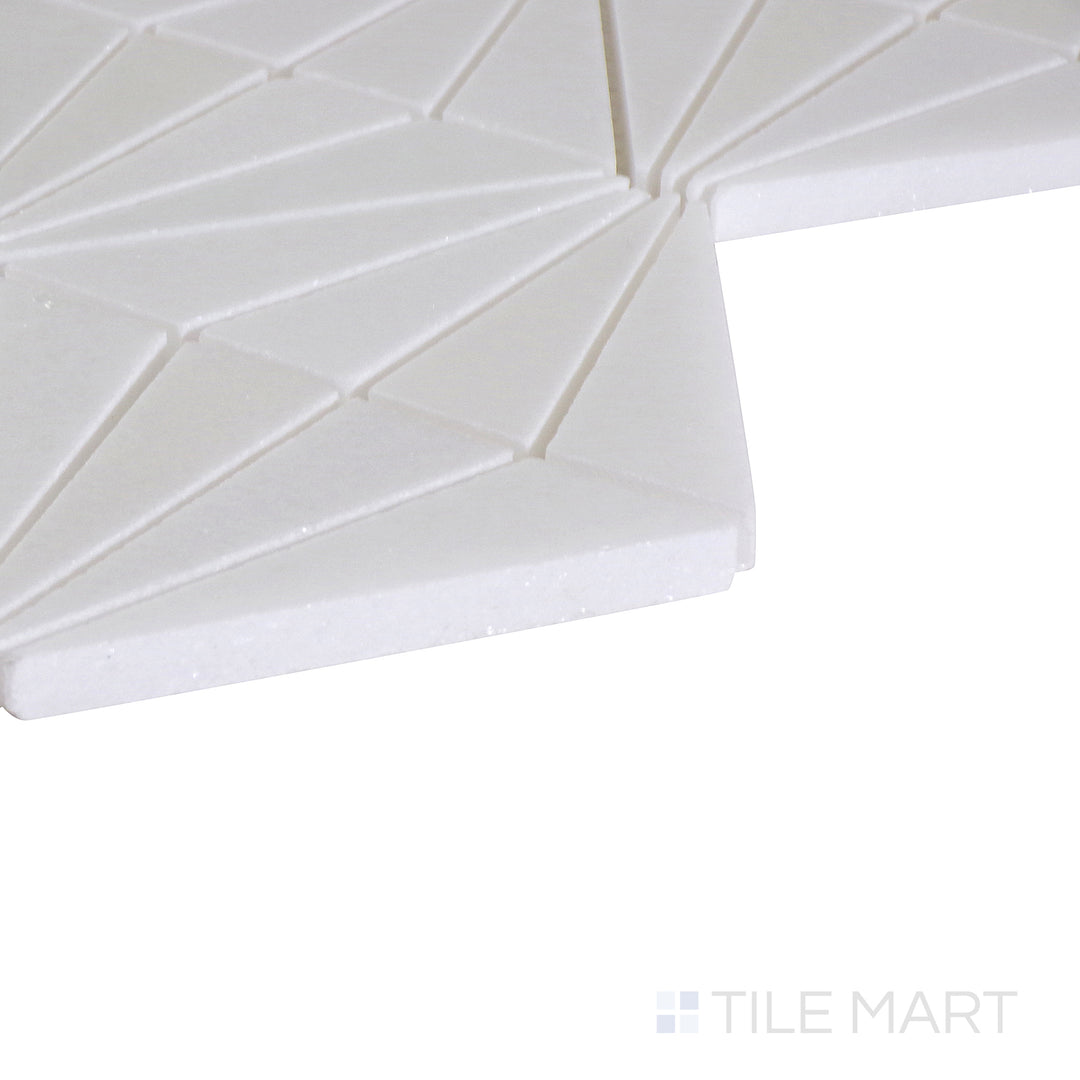 An angled shot of the tan and beige tile, revealing its polished surface and natural color variation.