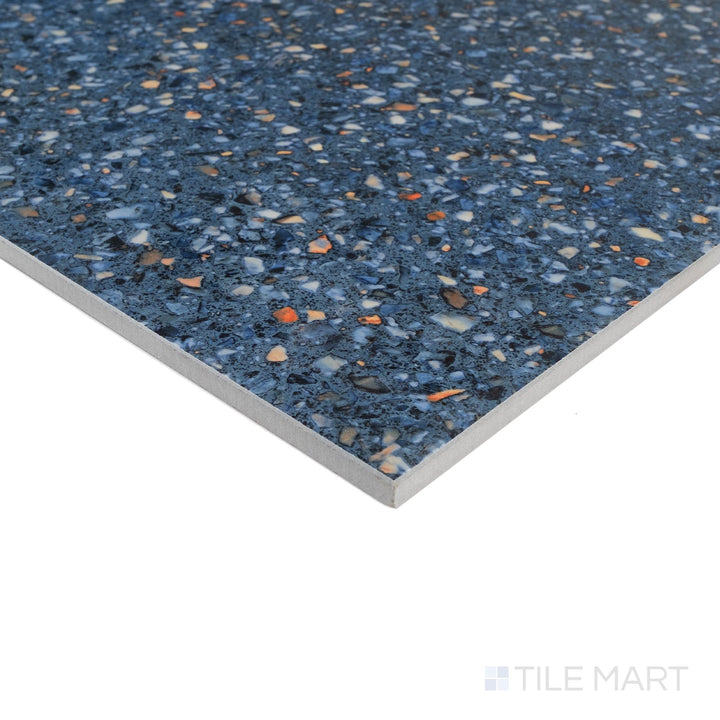 Corner detail of Mystere Blue 24x24 semi gloss porcelain tile highlighting rich color and smooth polished sheen.