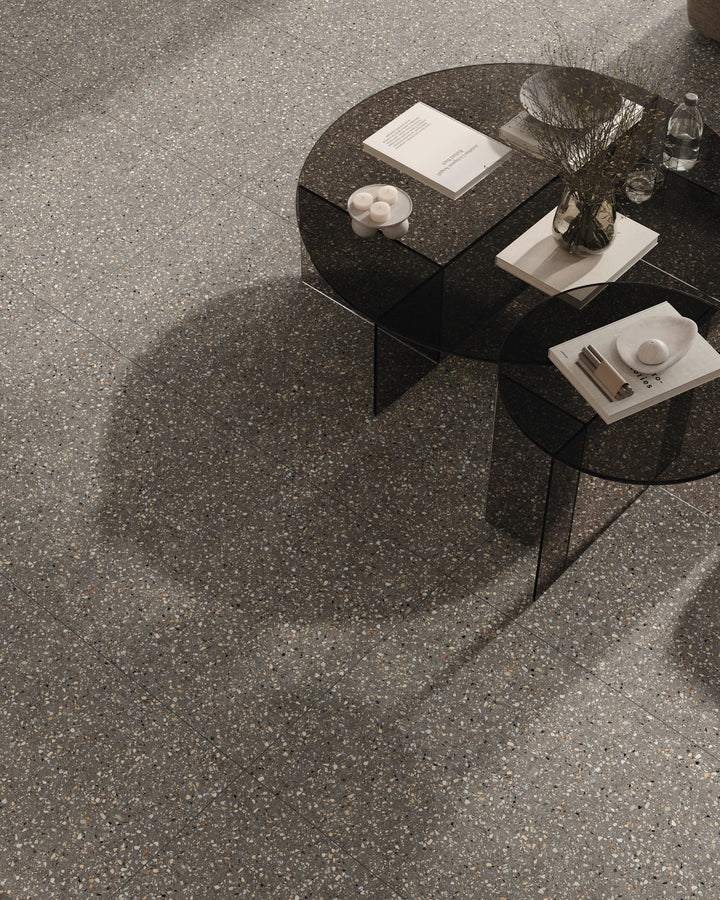 Mystere Dark Grey Semi Gloss Porcelain shown in a refined setting, emphasizing shadowed tone and luminous surface.