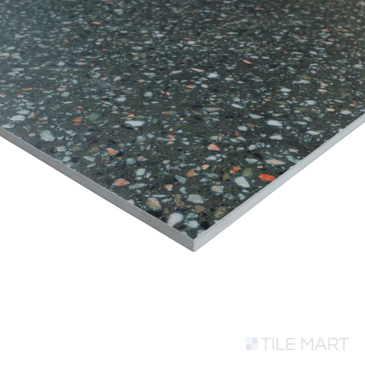 Corner detail of Mystere Green 24x24 semi gloss porcelain tile capturing soft green tone and refined glazed texture.