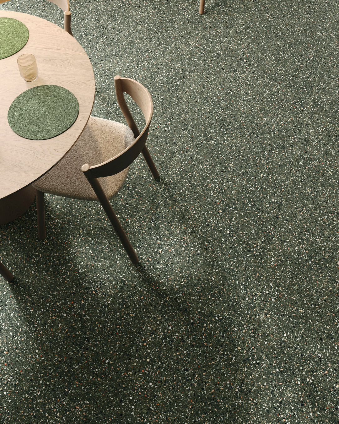 Mystere Green Semi Gloss Porcelain presented in a curated space with subtle shine and organic color flow.