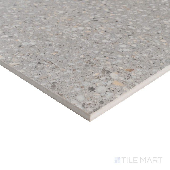 Corner view of Mystere Light Grey 24x24 semi gloss porcelain tile highlighting neutral tone and glossy smooth finish.