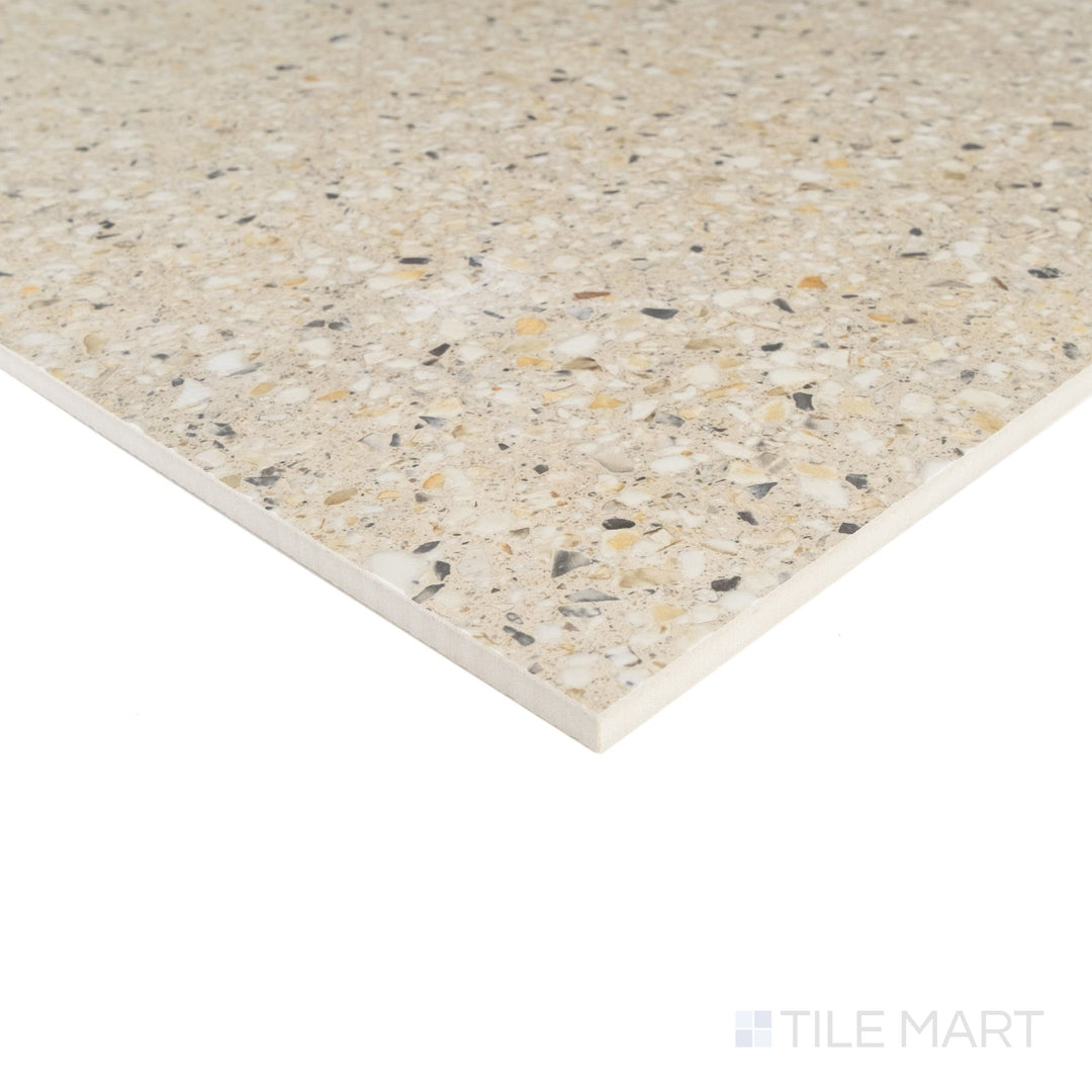 Corner detail of Mystere Sand 24x24 semi gloss porcelain tile capturing soft sandy tone and polished smooth sheen.