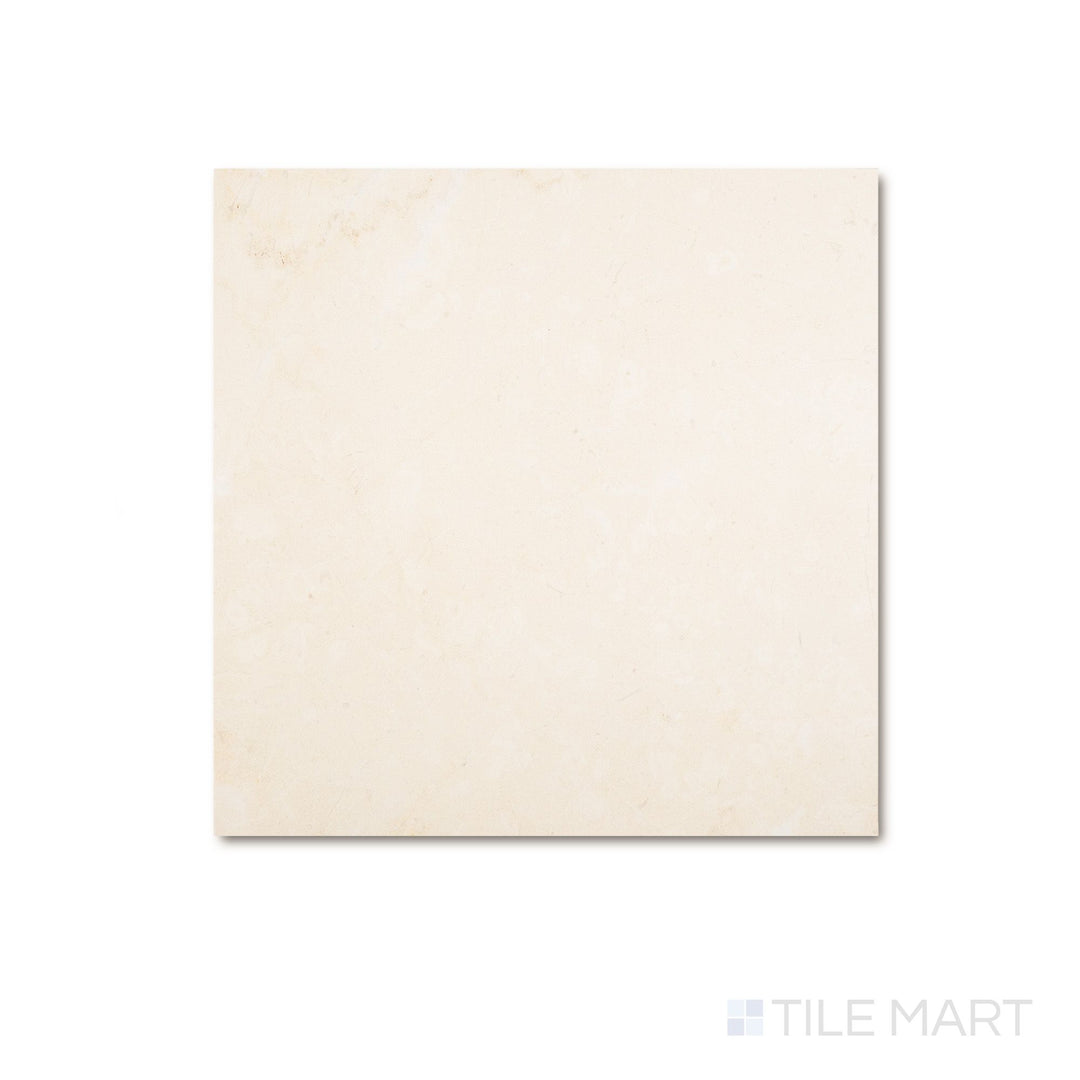 Overhead view of a 12x12 Palazzo Crema natural porcelain tile in warm ivory with a soft matte surface and subtle stone-like tone variation