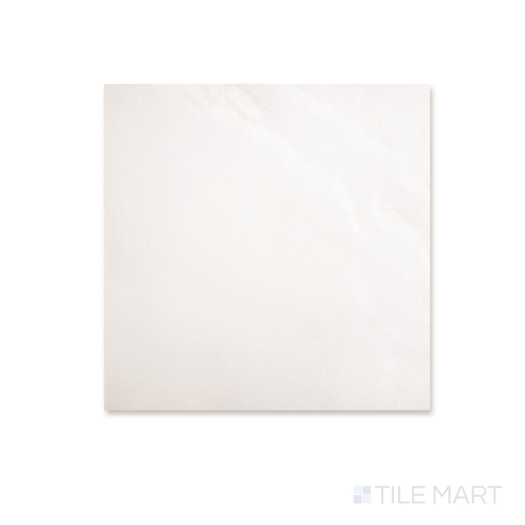 Top-down view of a 12x12 Palazzo Luce natural porcelain tile with a soft luminous tone and delicate light stone-inspired surface detail