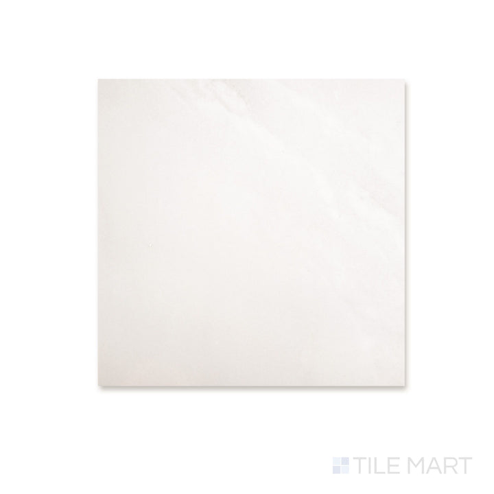 Top-down view of a 12x12 Palazzo Luce natural porcelain tile with a soft luminous tone and delicate light stone-inspired surface detail