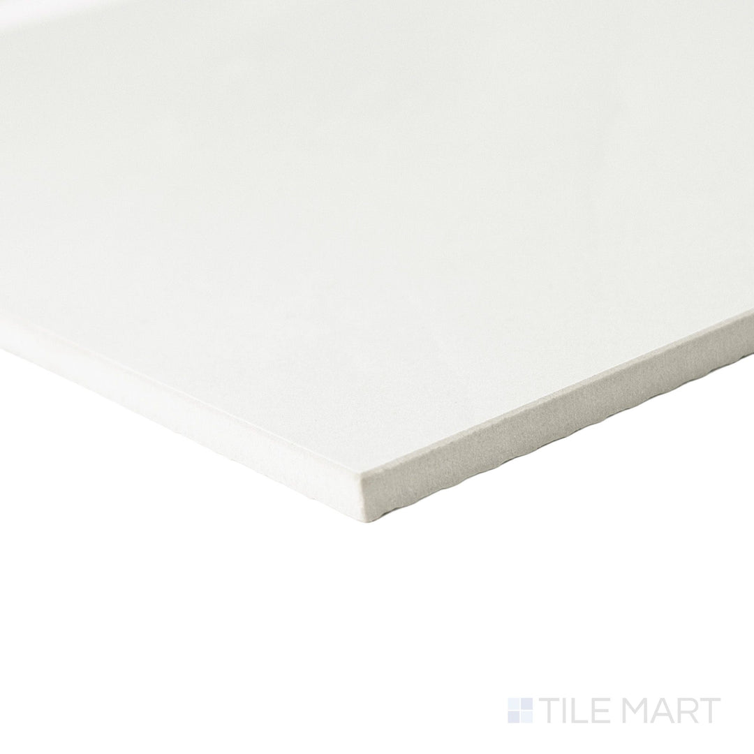Corner perspective of a 12x12 Palazzo Luce natural porcelain tile displaying its precise edge finish and soft luminous matte tone