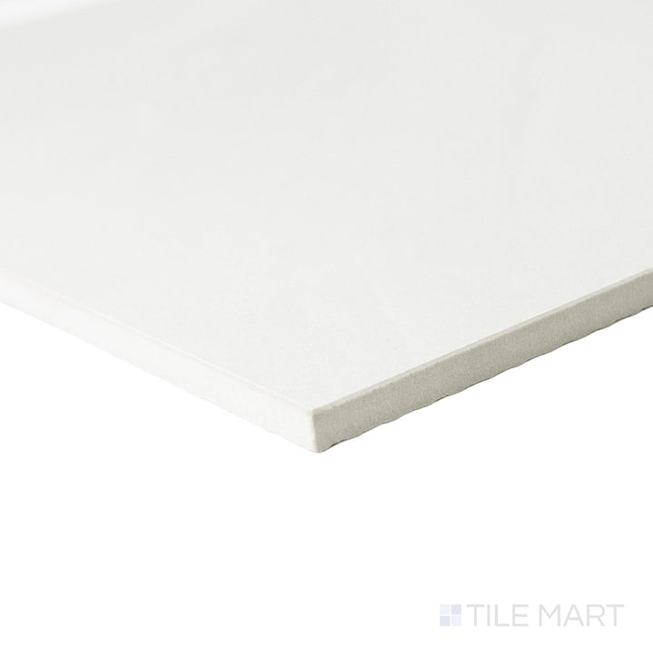 Corner perspective of a 12x12 Palazzo Luce natural porcelain tile displaying its precise edge finish and soft luminous matte tone