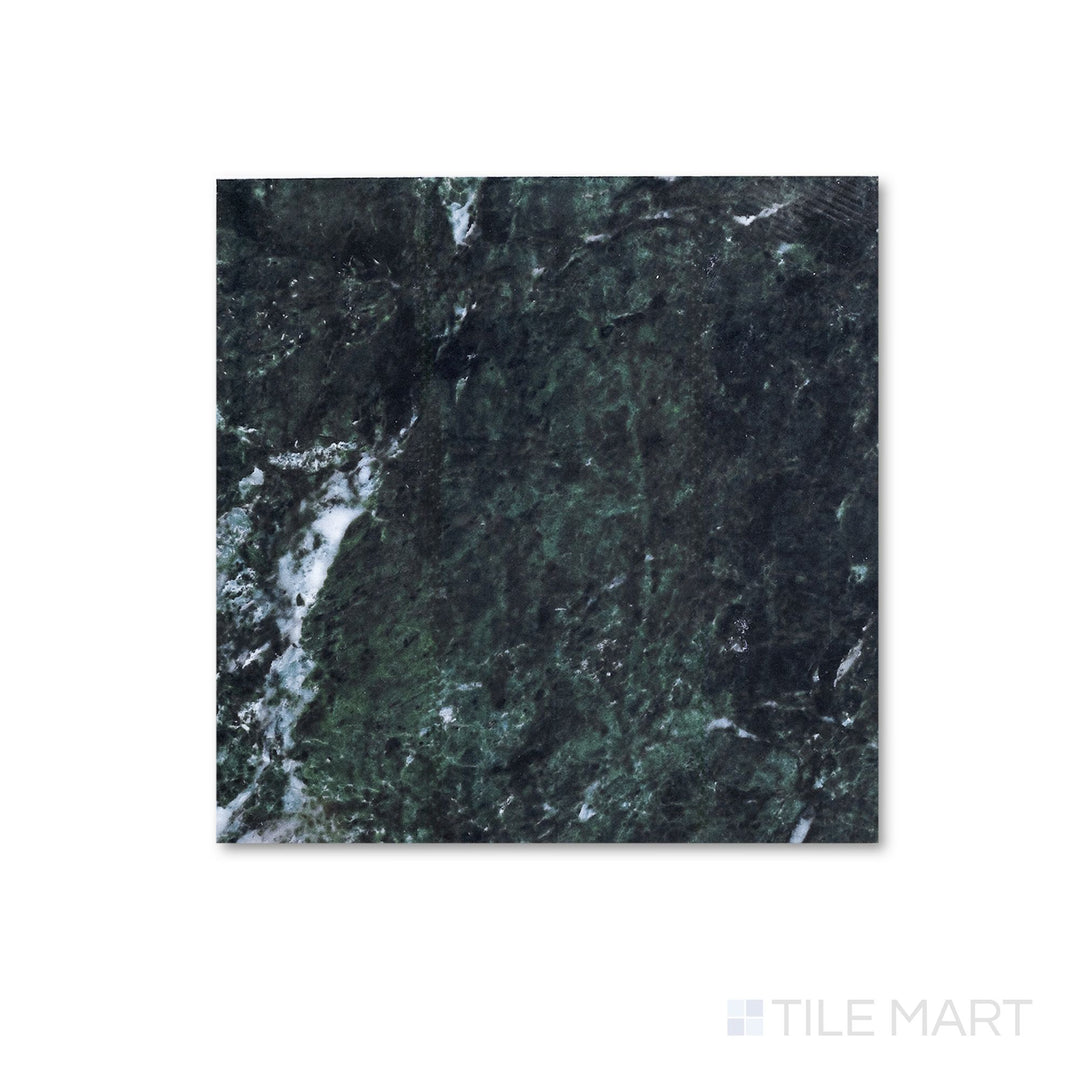 Flat lay of a 12x12 Palazzo Verde polished porcelain tile with a high-gloss finish intensifying its earthy green-grey stone-inspired tones