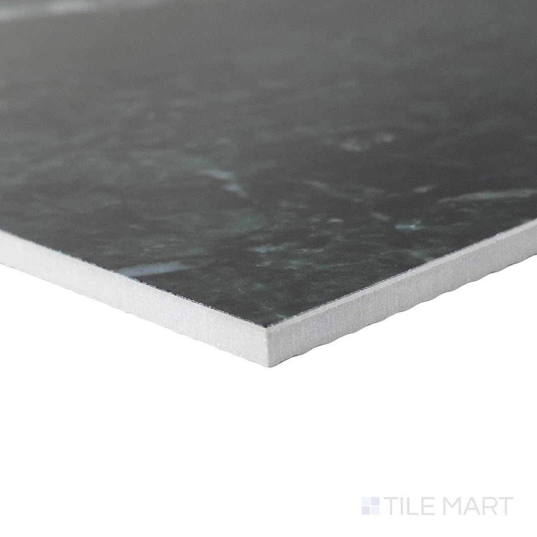 Corner angle of a 12x12 Palazzo Verde polished porcelain tile revealing its crisp rectified profile and glossy earthy green-grey surface