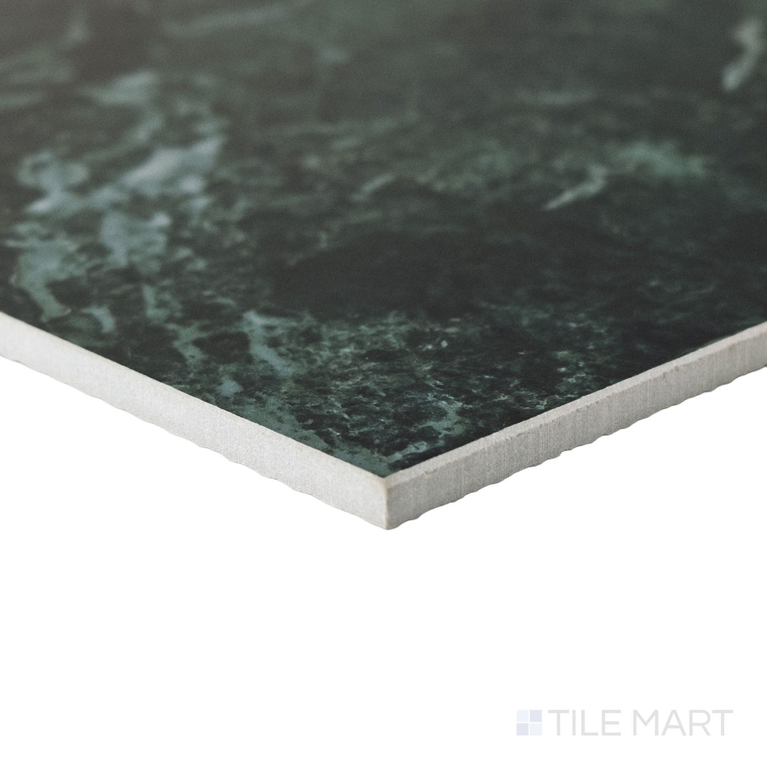 Corner shot of a large 24x24 Palazzo Verde natural porcelain tile showing its substantial edge thickness and earthy green-grey matte surface