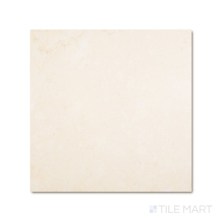 Top-down view of a 24x24 Palazzo Crema natural porcelain tile revealing warm ivory tones across a broad matte surface with gentle stone-like variation