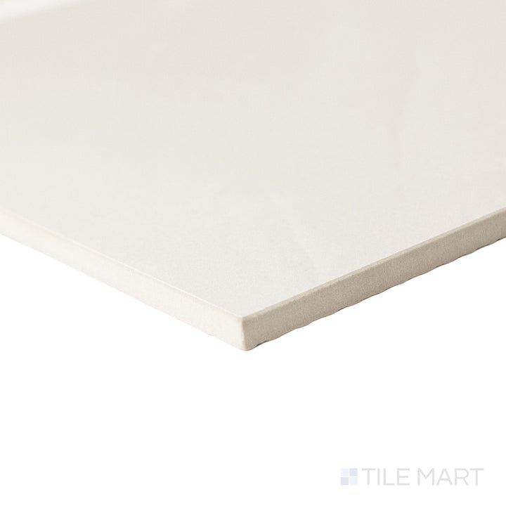Corner angle of a large 24x24 Palazzo Luce natural porcelain tile highlighting its rectified edge consistency and softly textured luminous matte tone