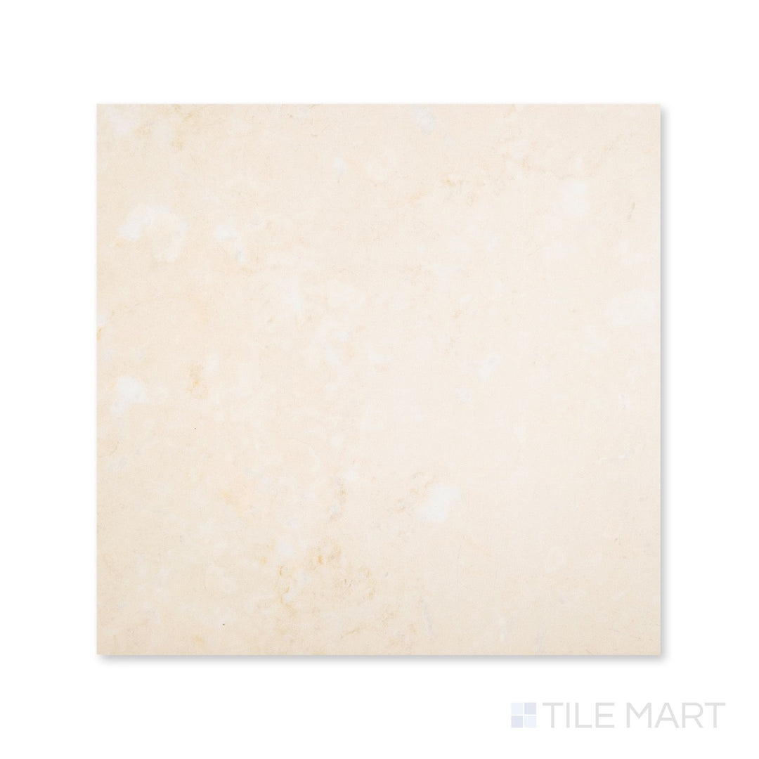 Top-down view of a 24x24 Palazzo Crema polished porcelain tile with a luminous glossy surface bringing out warm ivory and soft stone-like detail