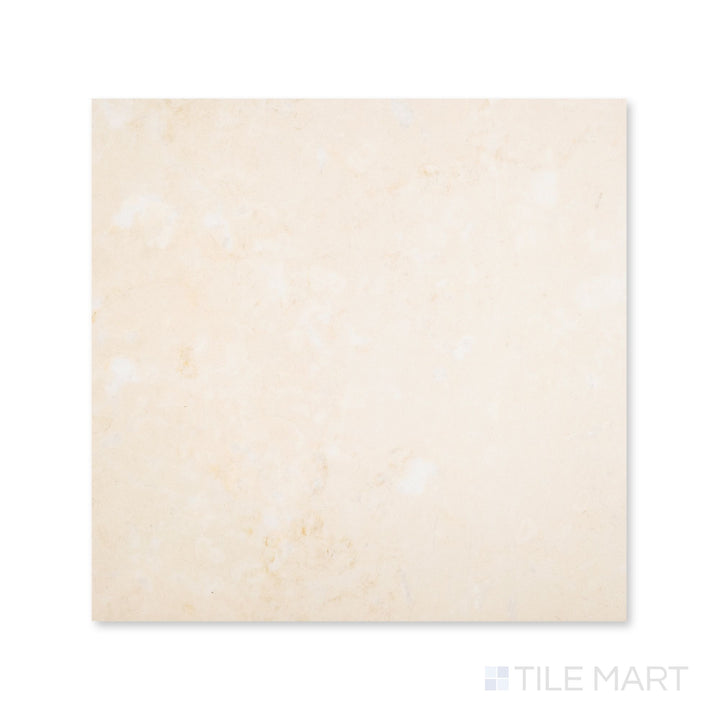 Top-down view of a 24x24 Palazzo Crema polished porcelain tile with a luminous glossy surface bringing out warm ivory and soft stone-like detail