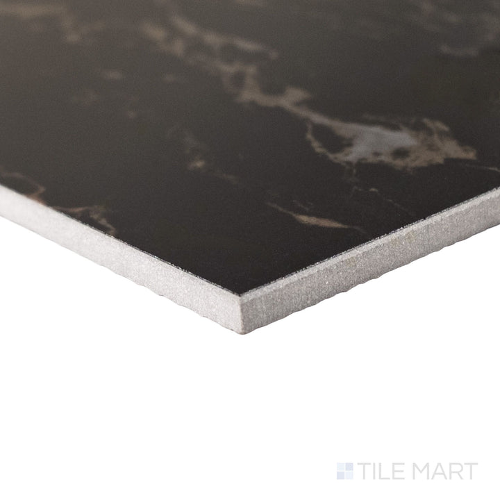 Corner perspective of a large 24x24 Palazzo Nero polished porcelain tile revealing its precise rectified profile and bold deep black mirror-like gloss finish