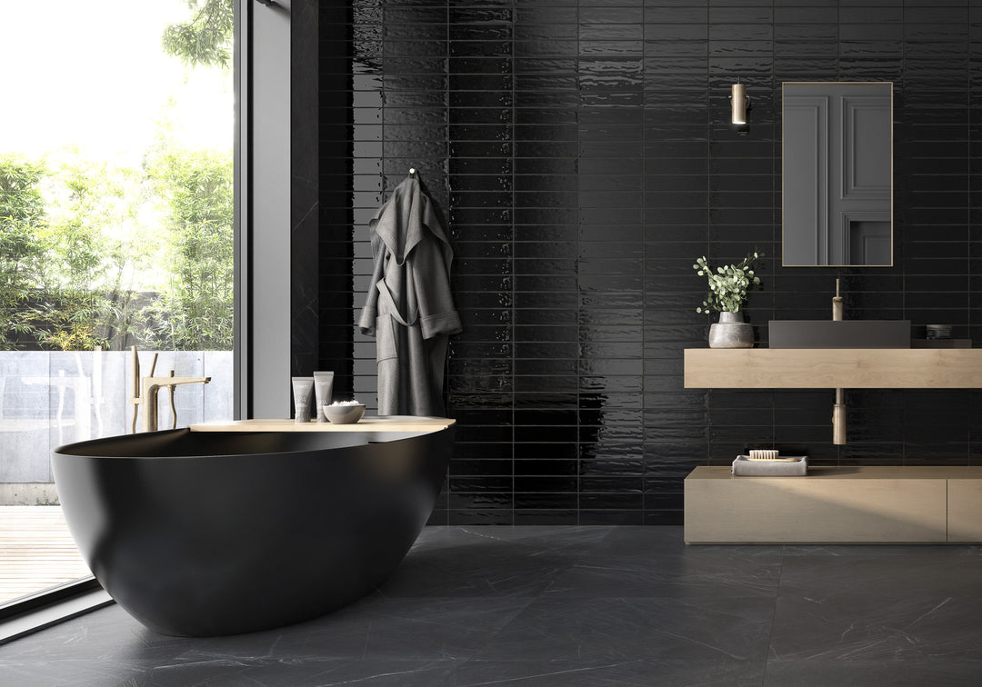 Artesano Black 3X12 bright ceramic tile delivers a bold and dramatic statement, perfect for striking, contemporary designs.