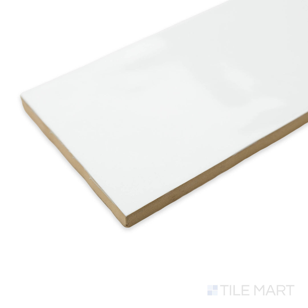 Corner shot of Artesano White Ice 3X12 bright ceramic tile, featuring a clean white hue, high-gloss sheen, and seamless alignment at the tile’s intersection.