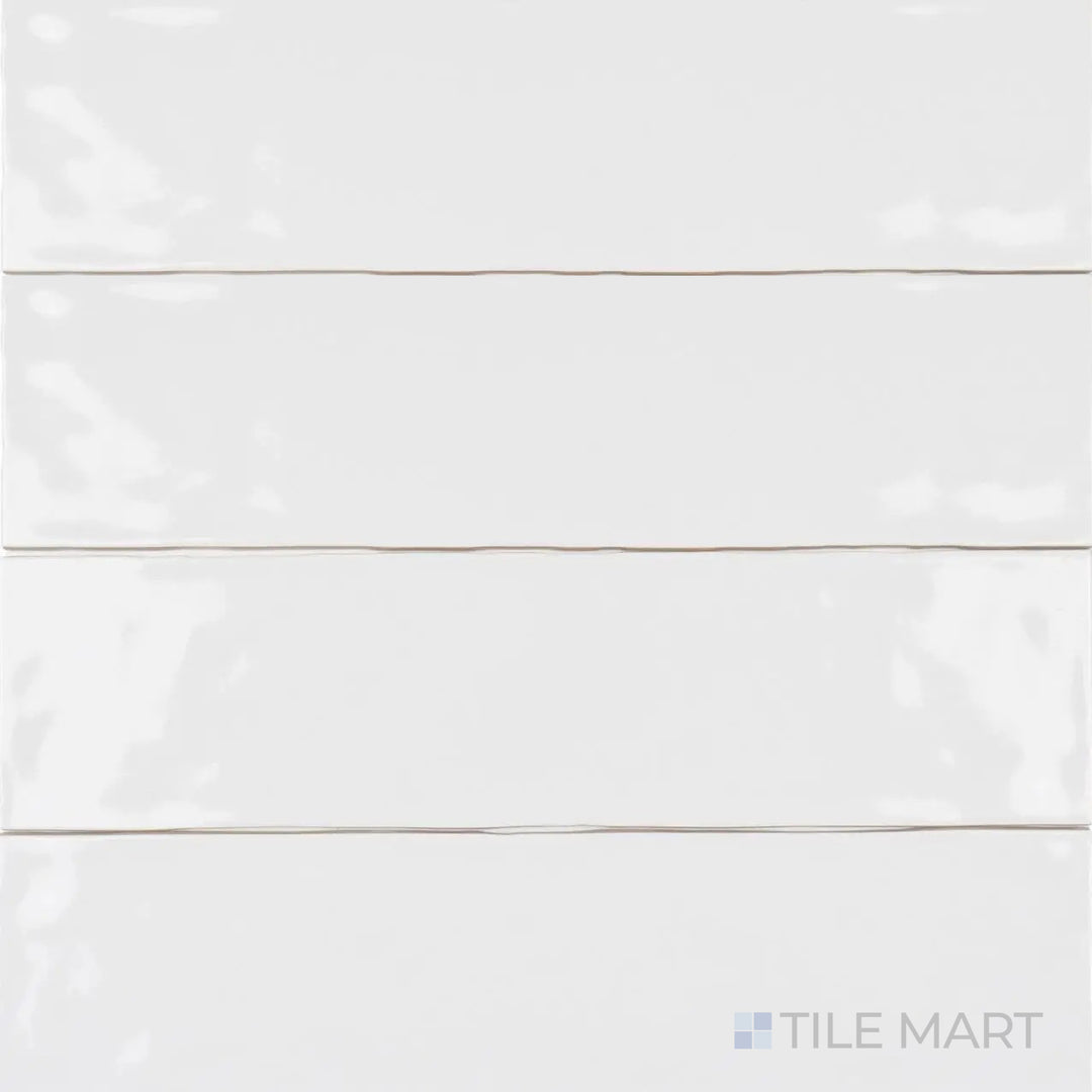 Captured from a bird’s-eye view, the Artesano White Ice 3x12 inch matte ceramic tile showcases its crisp white shade and soft, glare-free texture, ideal for a minimalist design.