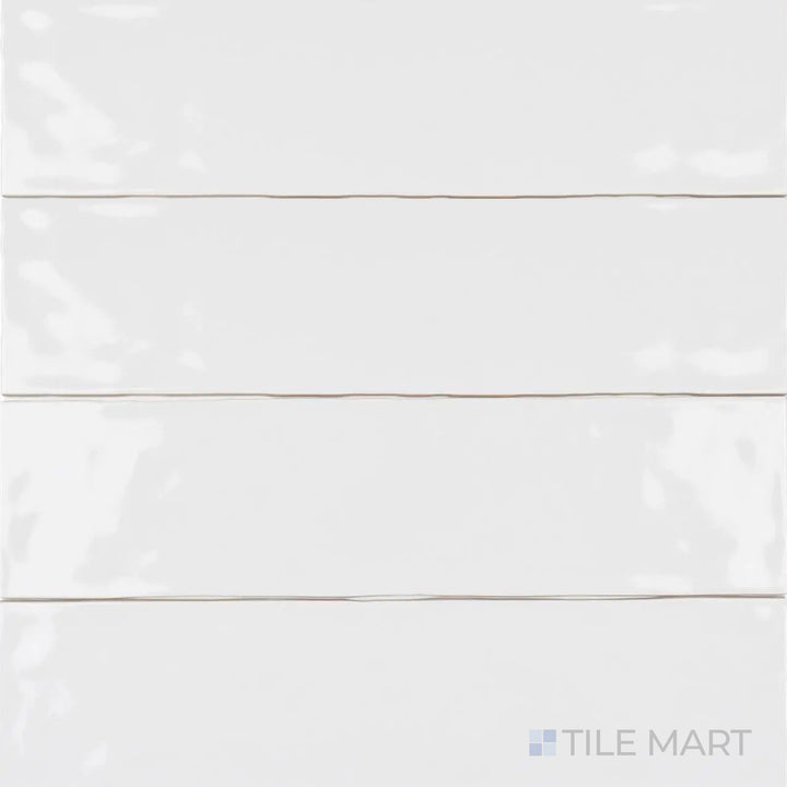 Captured from a bird’s-eye view, the Artesano White Ice 3x12 inch matte ceramic tile showcases its crisp white shade and soft, glare-free texture, ideal for a minimalist design.