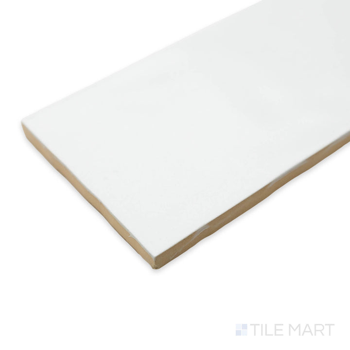 Angled close-up of Artesano White Ice 3X12 matte ceramic tile, displaying its fresh white color, soft matte finish, and the precise transition where tiles meet at the corner.