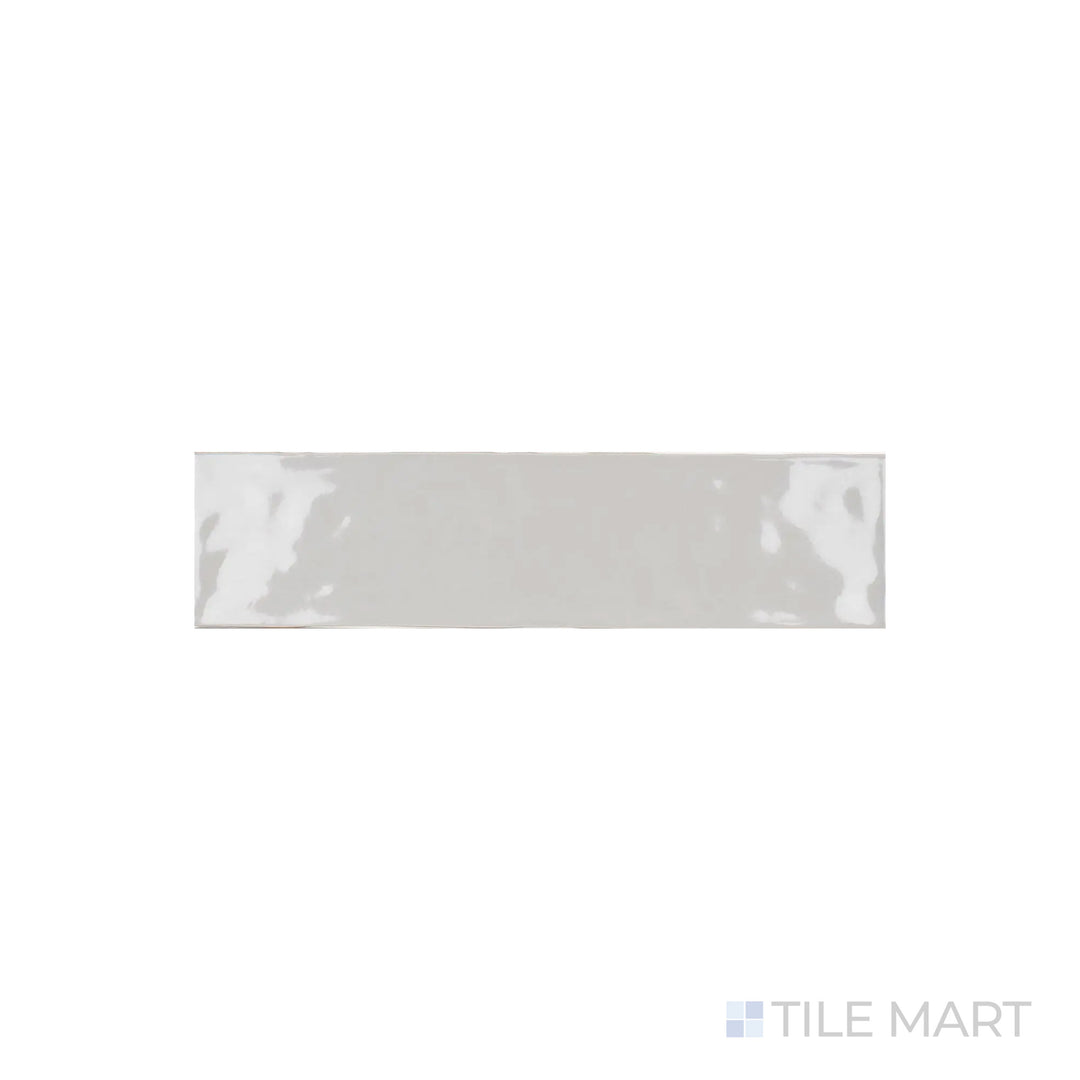 A focused shot of Artesano Neu Gray 3X12 Bright Ceramic captures its cool gray tone and glossy surface, adding a refined touch to any space.