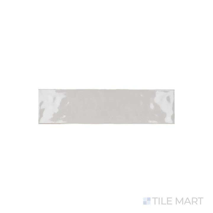 A focused shot of Artesano Neu Gray 3X12 Bright Ceramic captures its cool gray tone and glossy surface, adding a refined touch to any space.