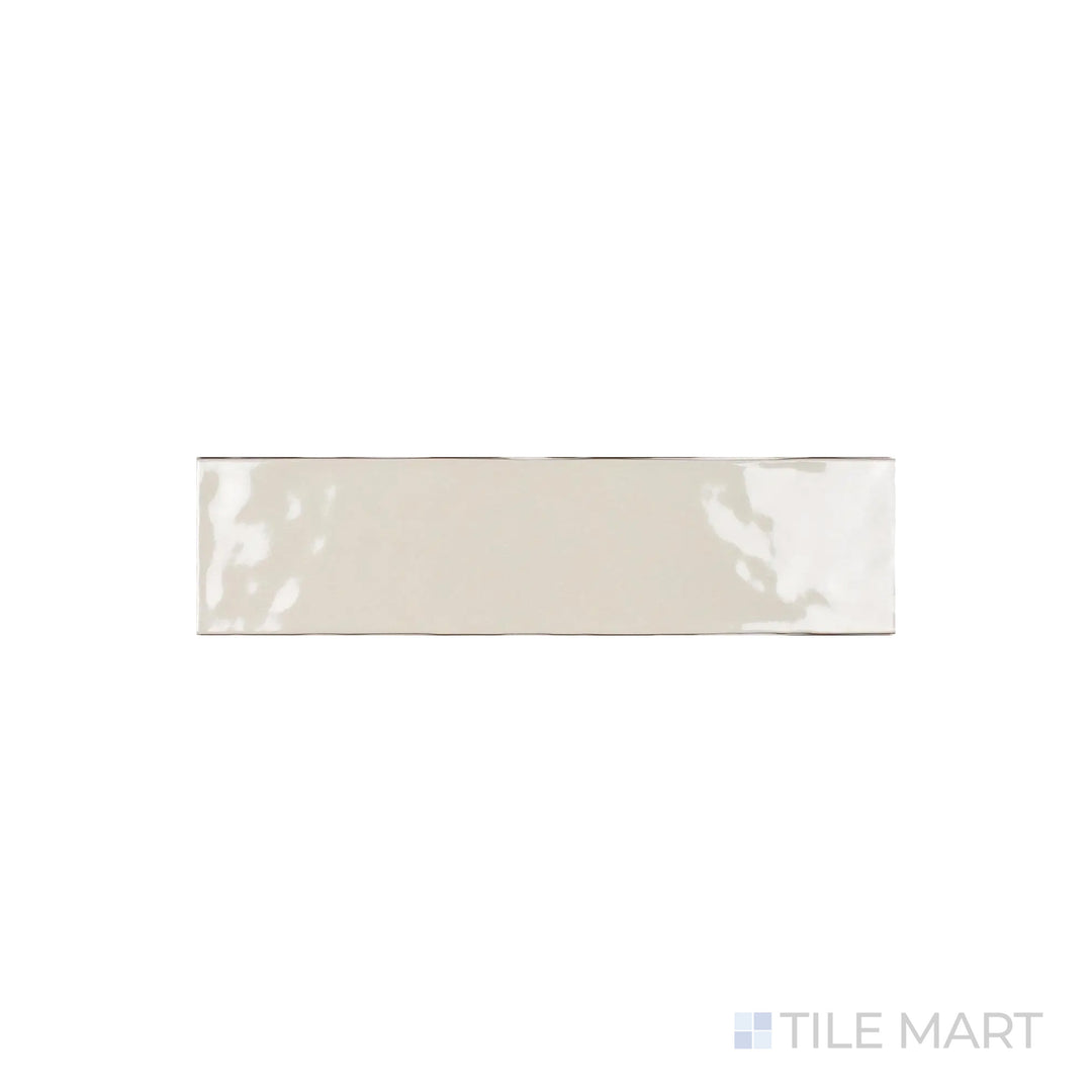 A close-up look at Artesano Biscuit 3X12 Bright Ceramic showcases its warm beige tone with a glossy sheen, perfect for cozy and inviting interiors.