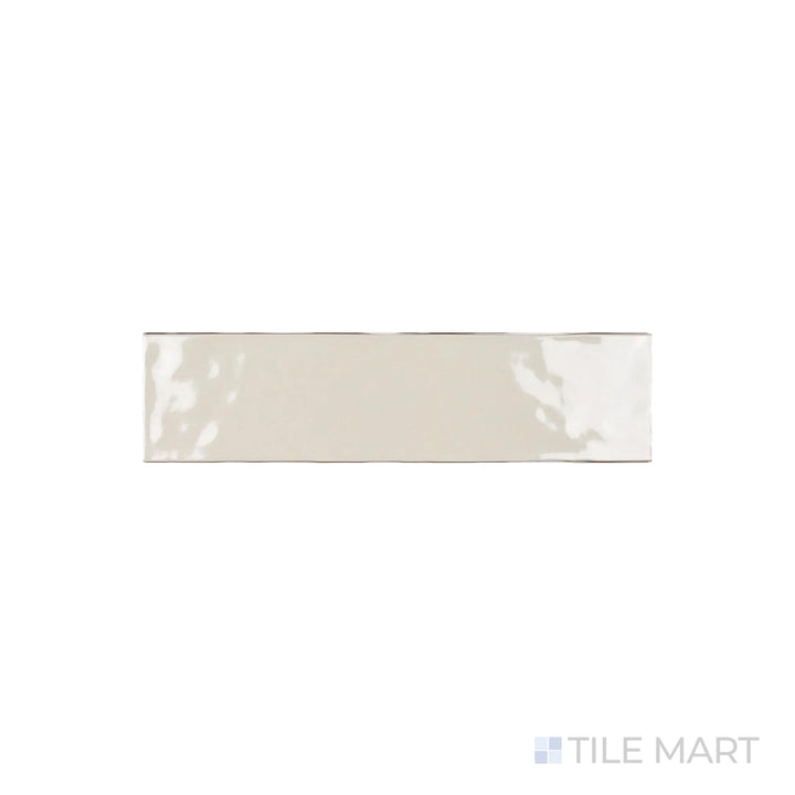 A close-up look at Artesano Biscuit 3X12 Bright Ceramic showcases its warm beige tone with a glossy sheen, perfect for cozy and inviting interiors.