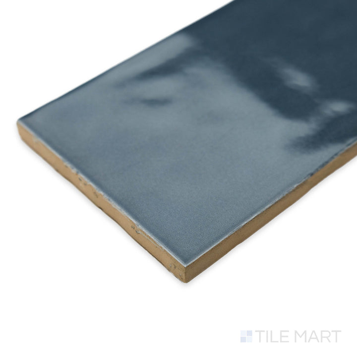 Angled perspective of Bar Tile Havre 3X12 bright ceramic, featuring its neutral tone, glossy finish, and the way tiles seamlessly meet at the corner.