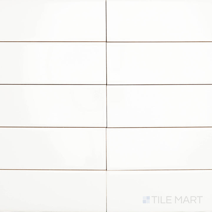 This overhead shot of the Block Blanco 2x10 inch bright ceramic tile captures its crisp white tone and reflective surface, enhancing light and creating a clean, modern aesthetic.
