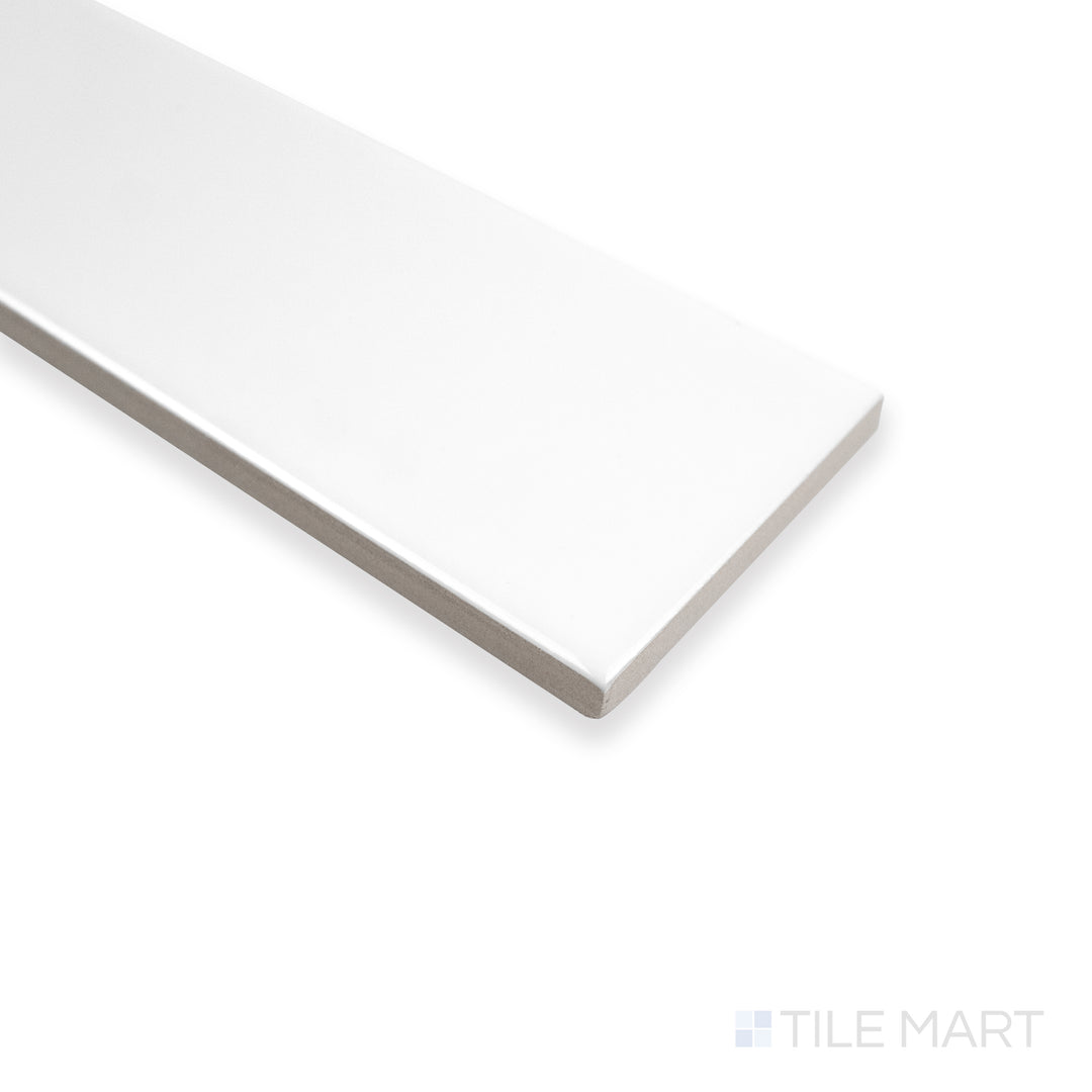 Corner shot of Block Blanco 2X10 bright ceramic tile, showcasing its pristine white surface, glossy finish, and crisp edge alignment.